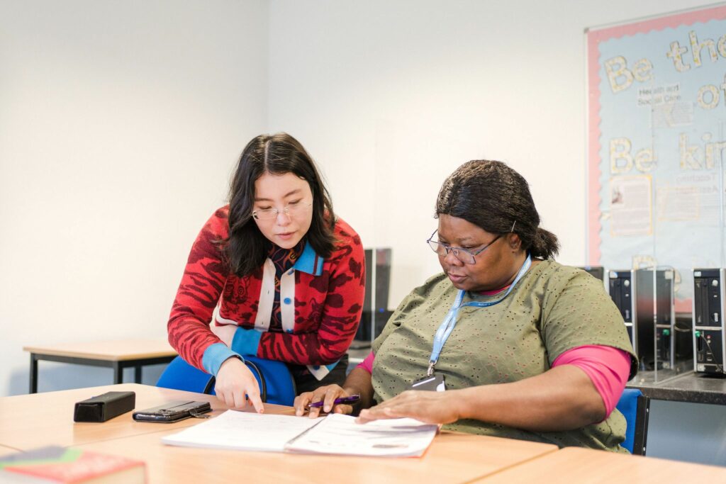 Deacon House adult learners helping each other study