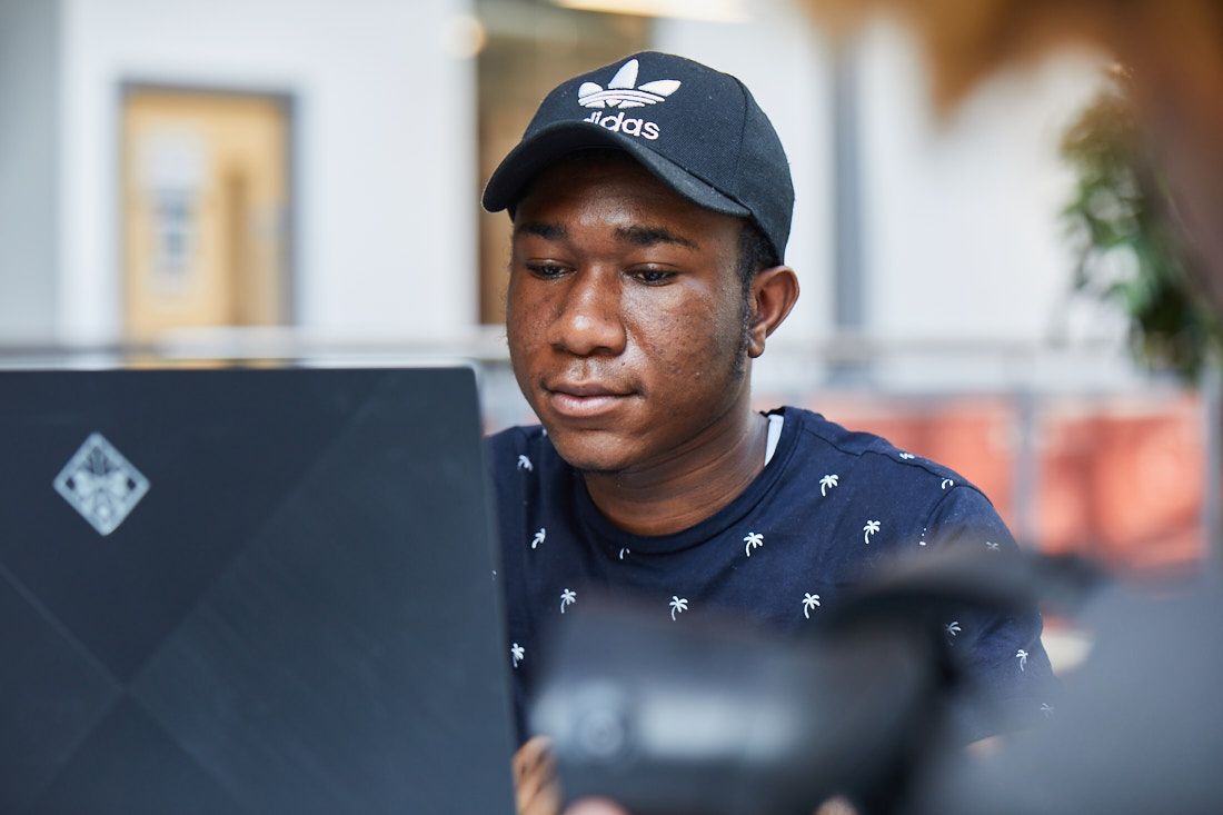 A student working on his laptop