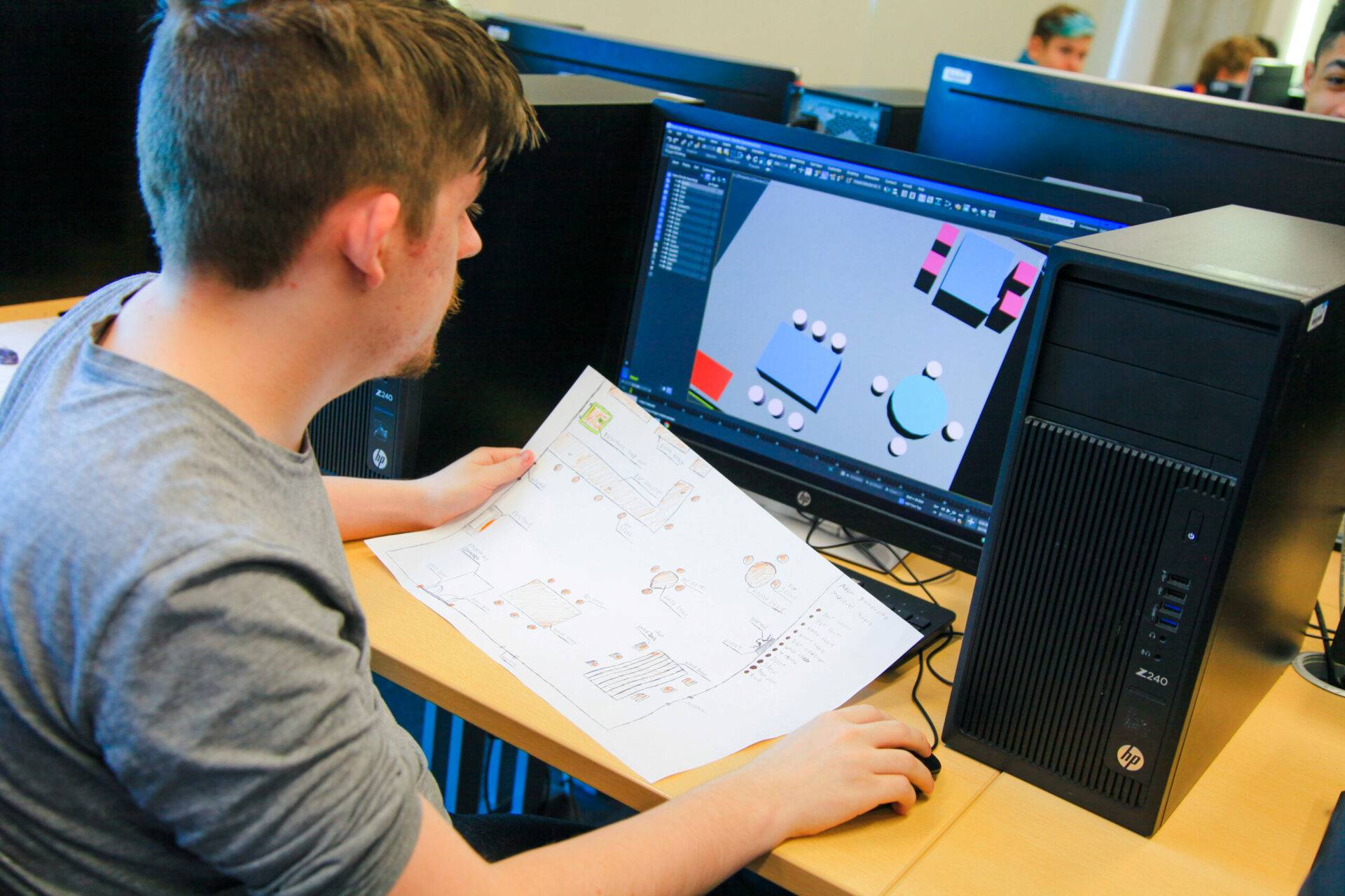 Games design student working on the initial stages of a map
