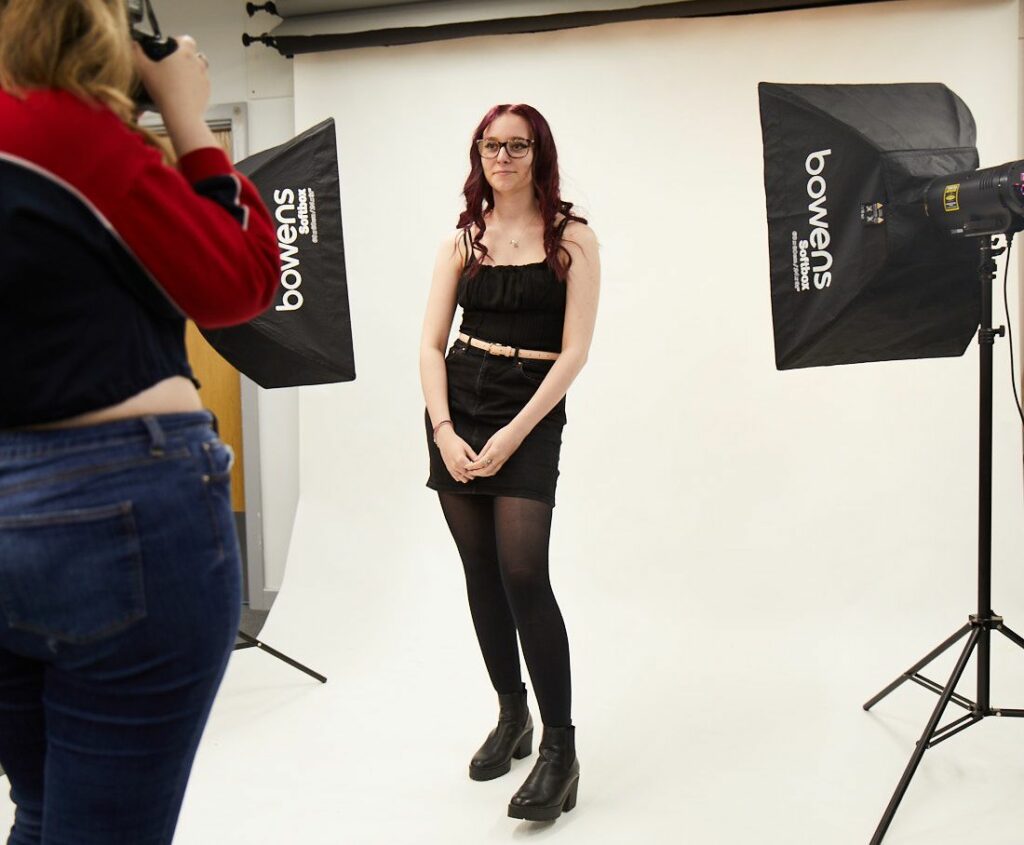 LCC Creative arts photography student taking photos in a studio