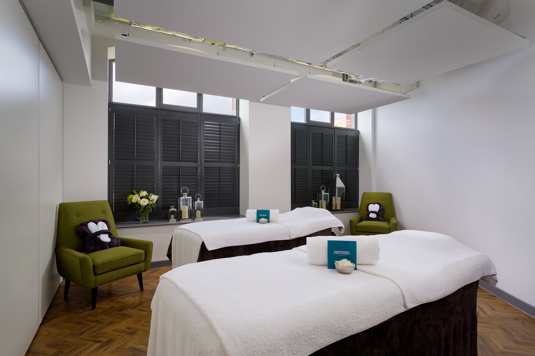 Two beauty salon beds and an armchair in Printworks Salon & Spa