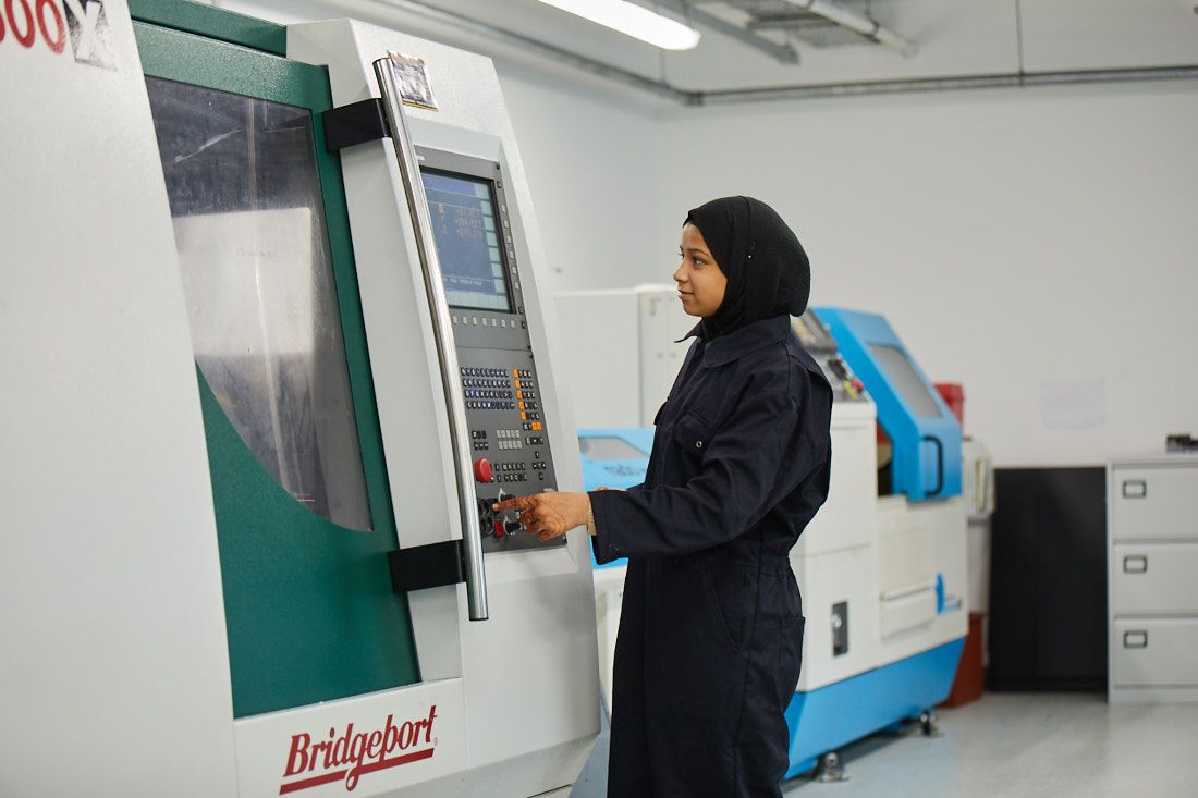 Engineering student at Leeds City College using a machine