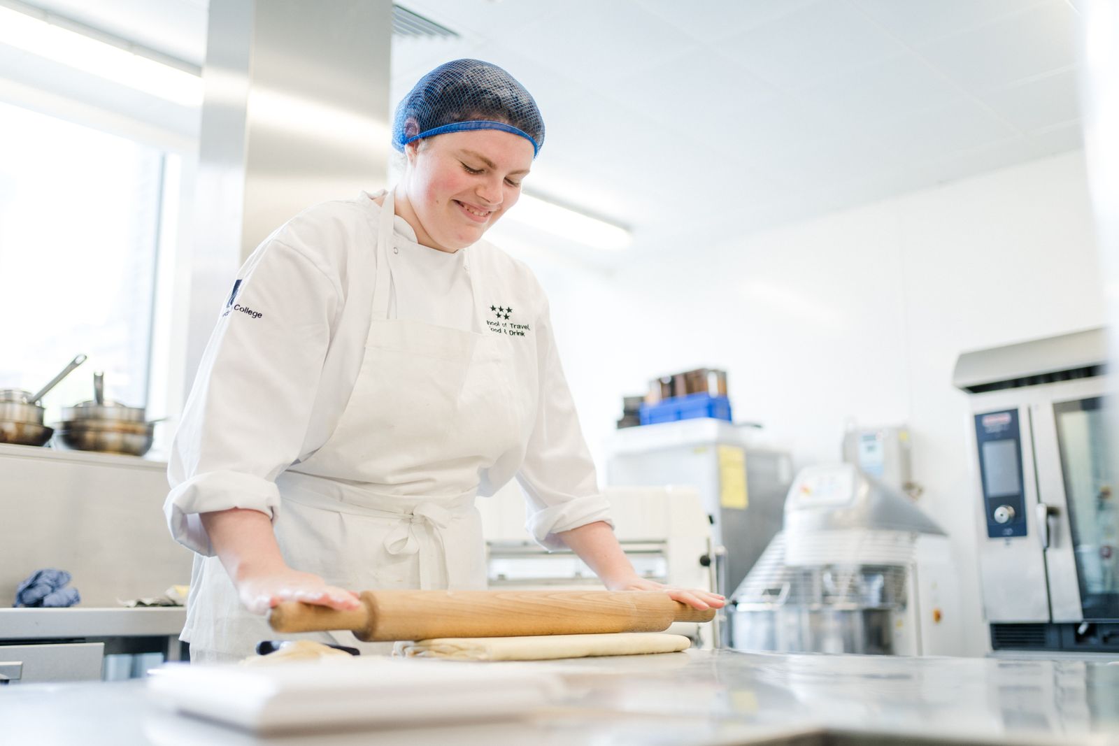 Leeds city college catering student rolling dough