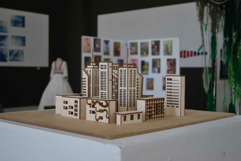 A group of buildings built using either thick card or wood to a miniature scale