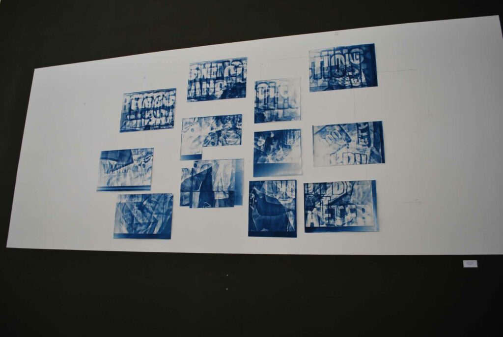 A collage of what appears to be graffiti in a limited colour pallet blue and white