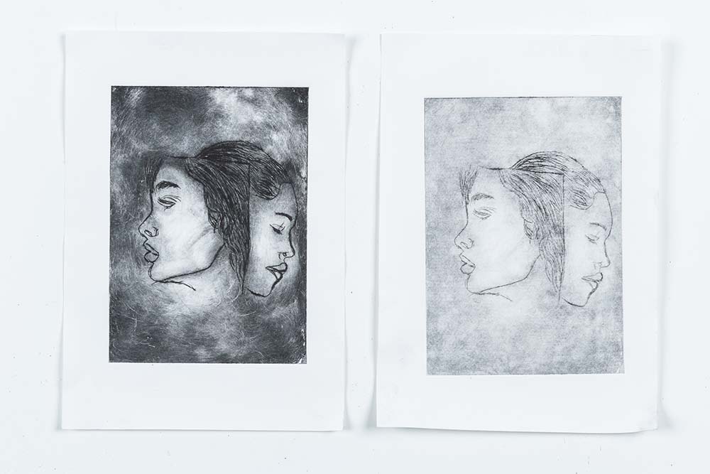 Sketch and print of two faces merged looking in opposite directions - coursework by Creative Arts Art and Design student