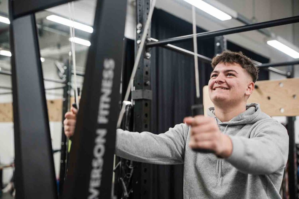 Student working out using sport facilities in fitness centre