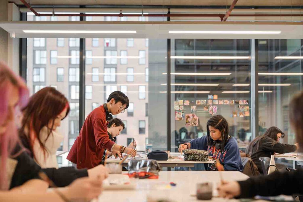 Students having art sessions in classroom