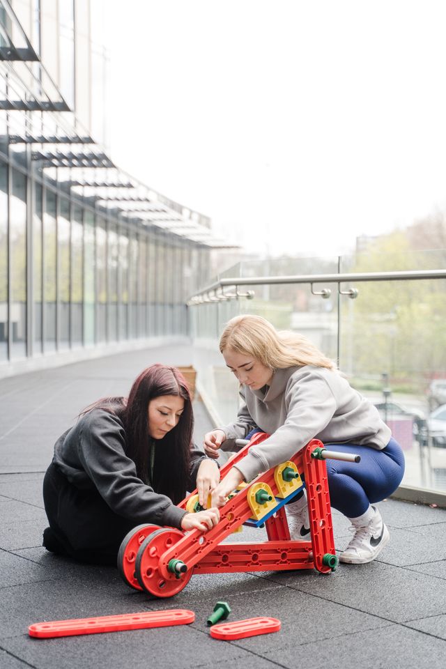 Two students at quarry hill putting together a self make it kit scooter