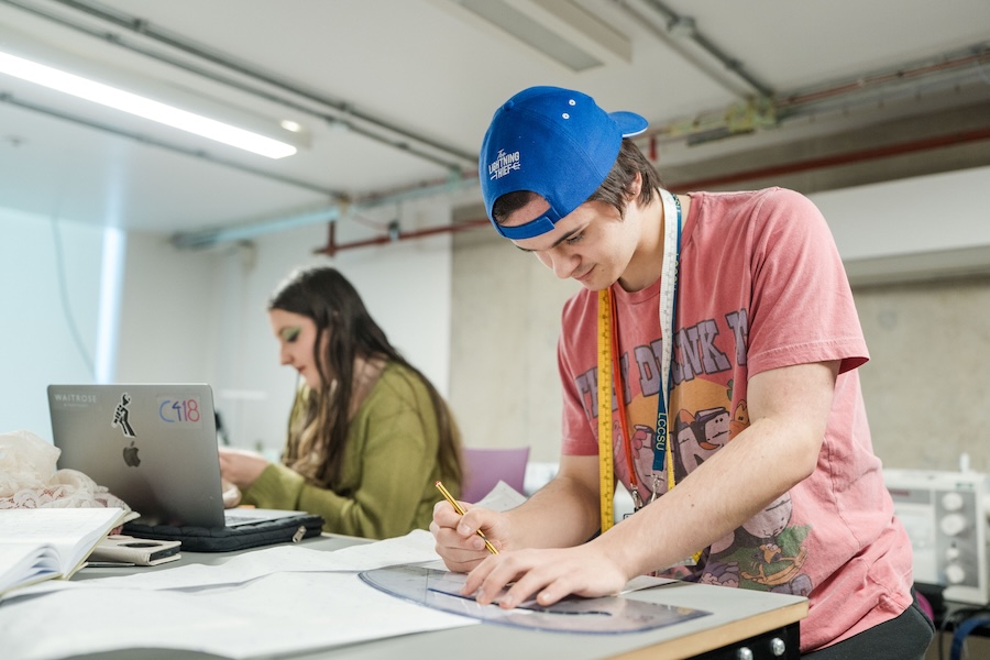 Theatre design students drawing up a design for a set