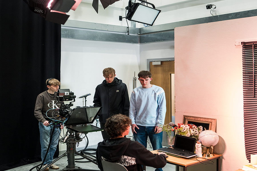 Film students setting up a scene ready to film