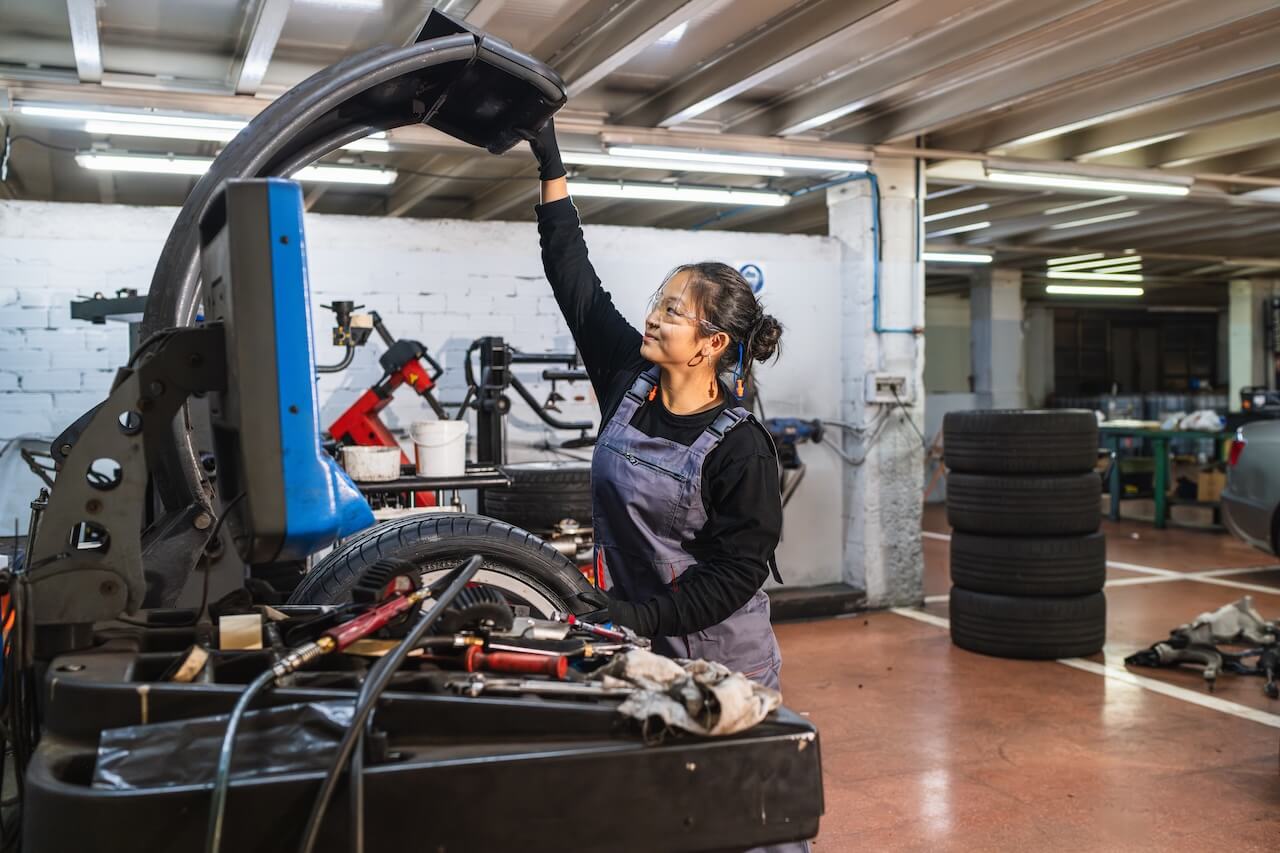 A student working on a car engine