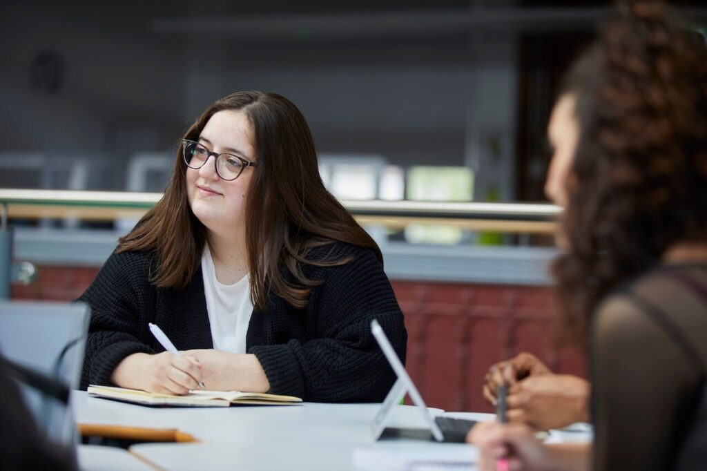 Student inside Printworks campus on the second floor of the red print room.