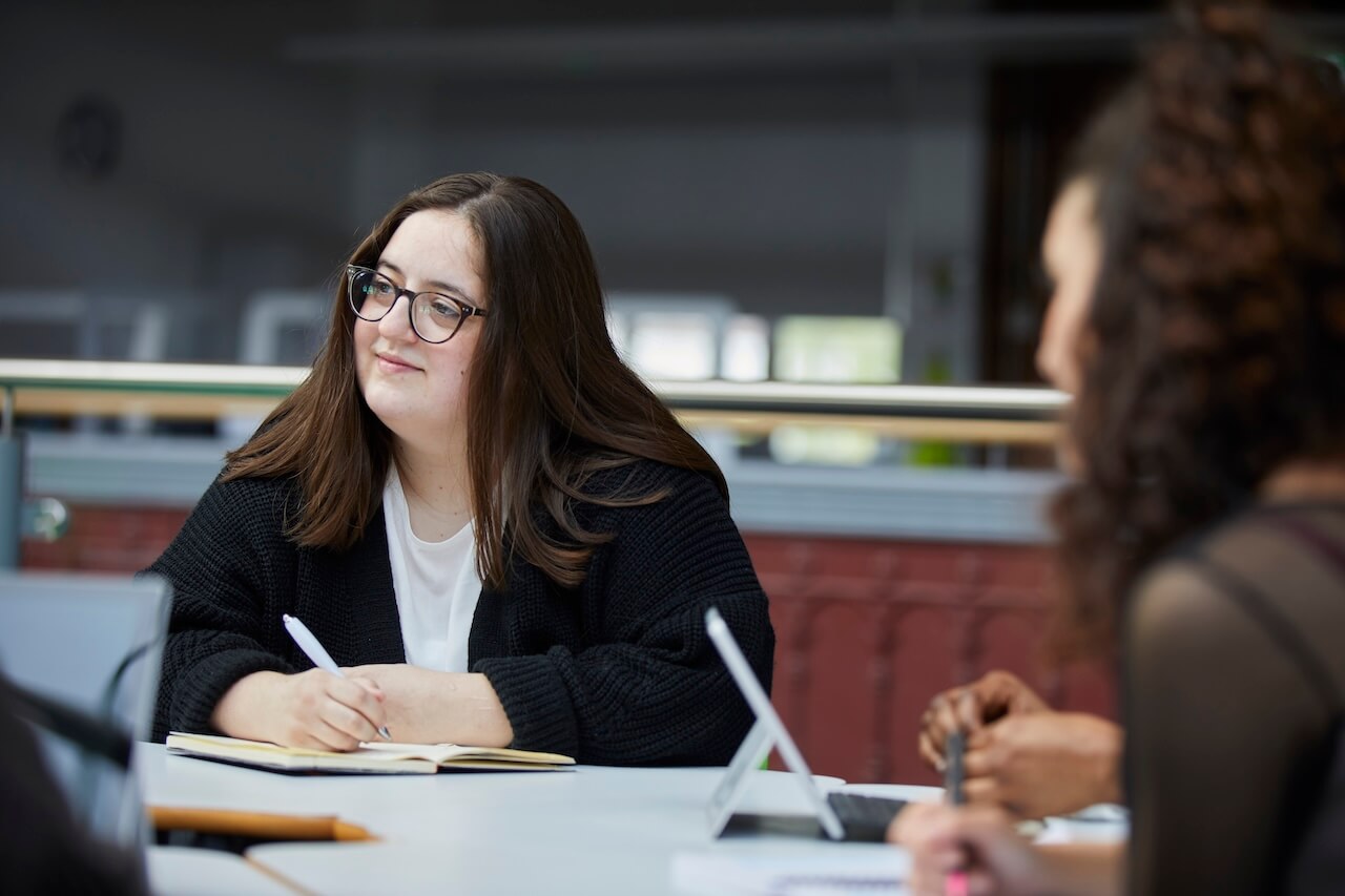 Student inside Printworks campus on the second floor of the red print room.