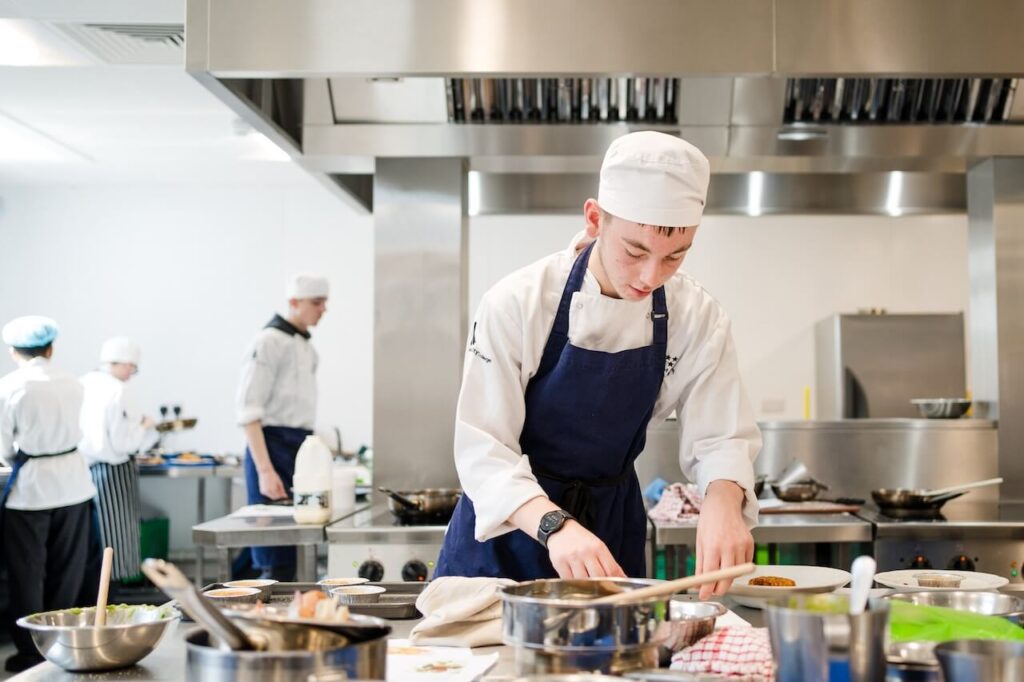 A student chef working in the kitchen