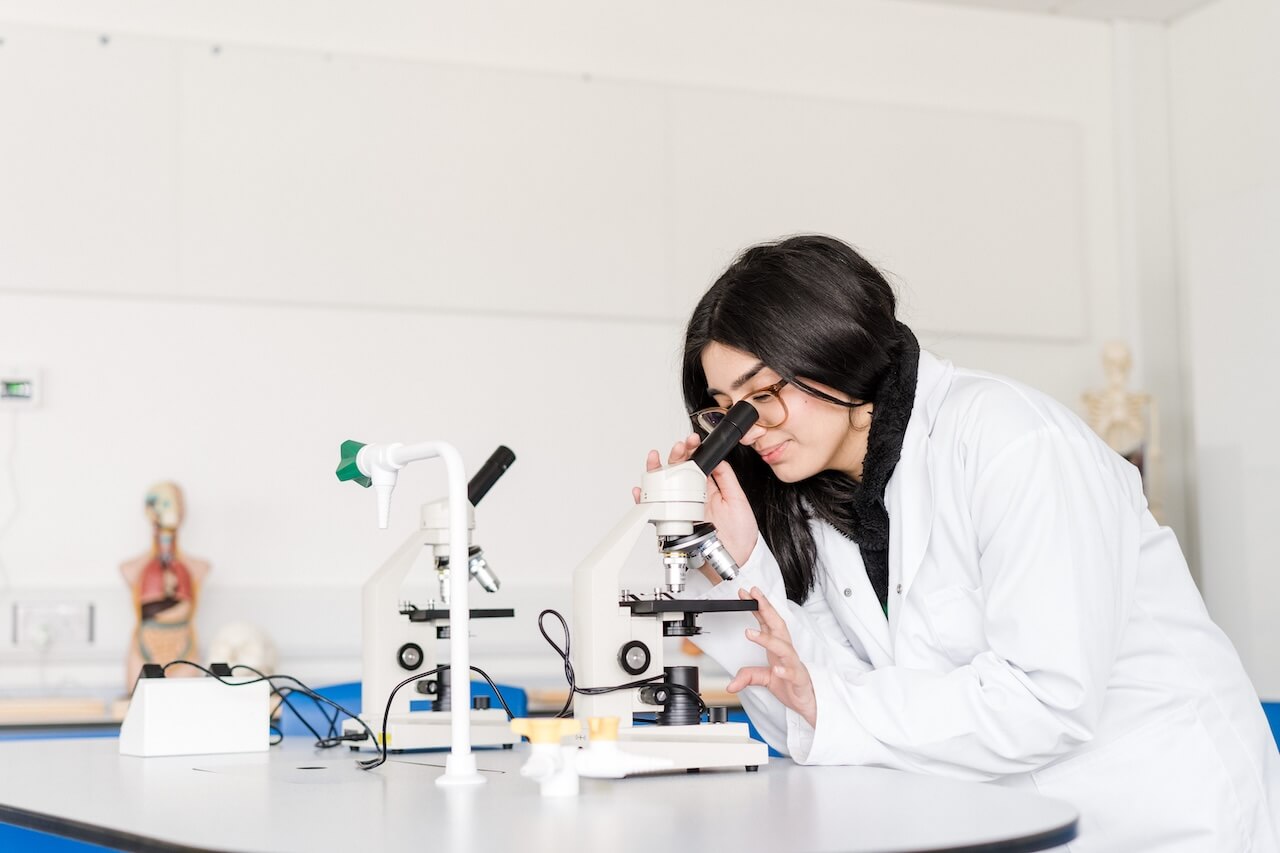A student using a microscope