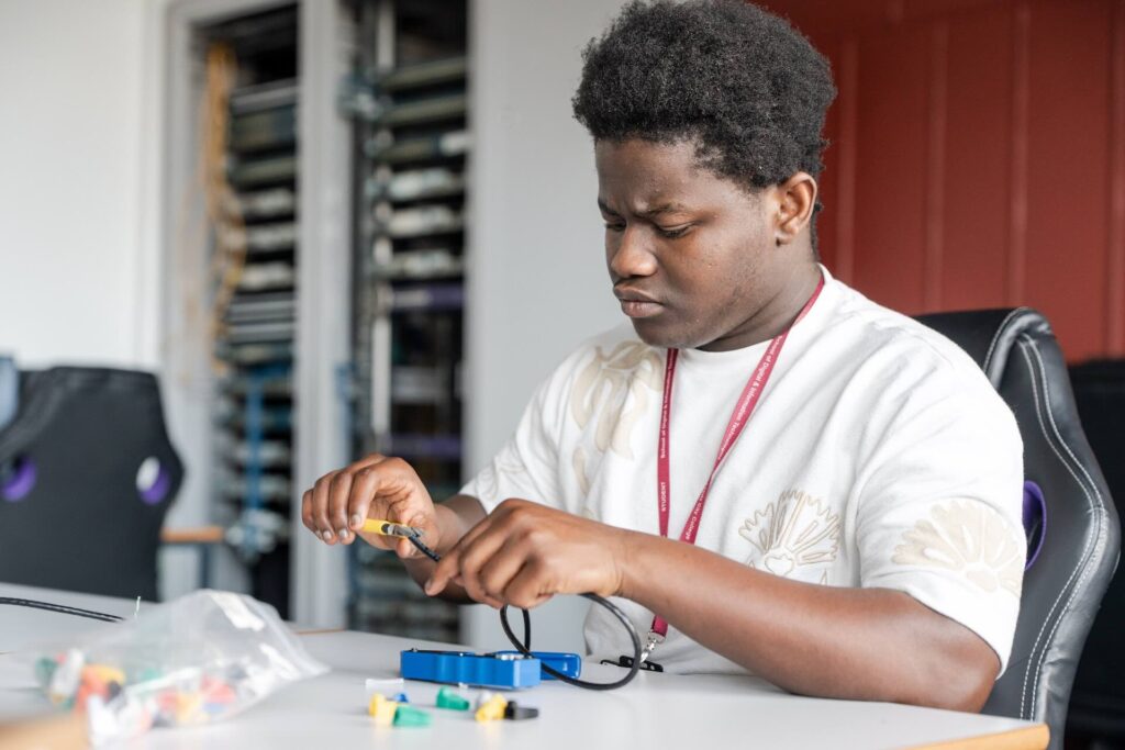 Digital and IT student working on circuitry components