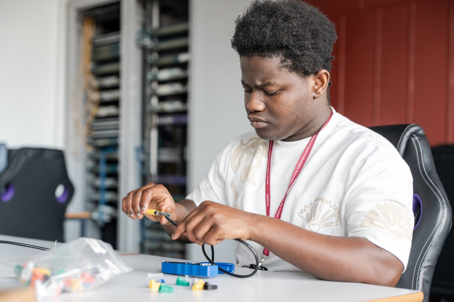Digital and IT student working on circuitry components