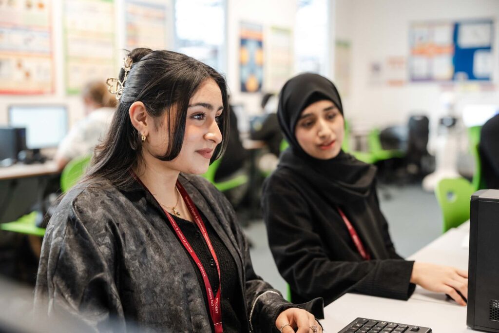 Two Digital and IT students working in the computer lab
