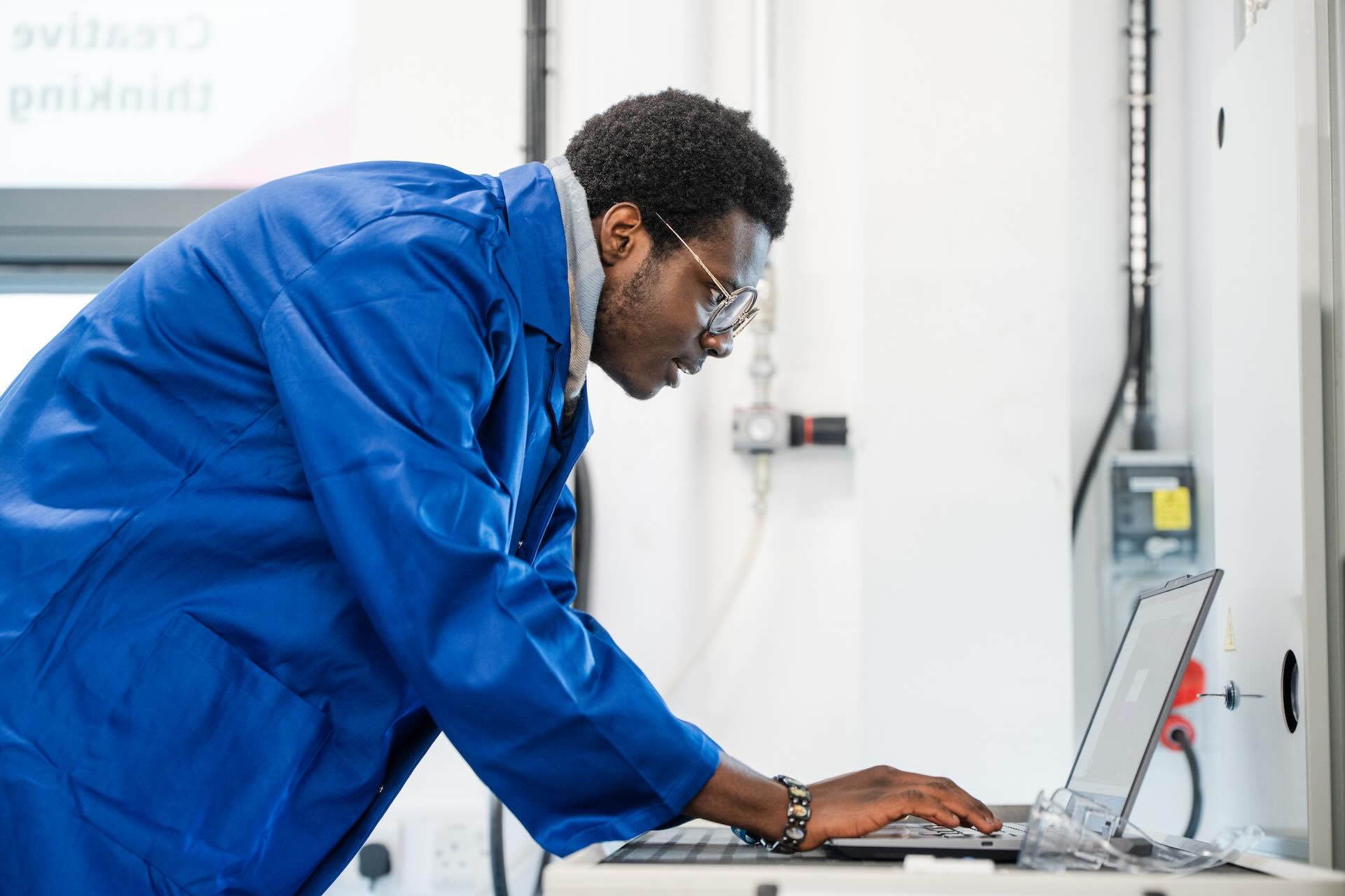 Engineering and Manufacturing student working on design on a laptop