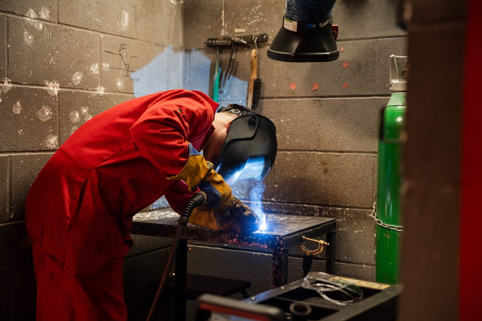 Engineering Student using a welder