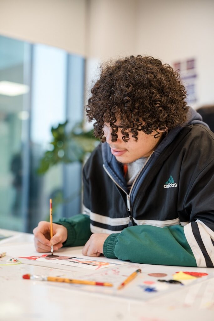 Student creating a watercolour painting