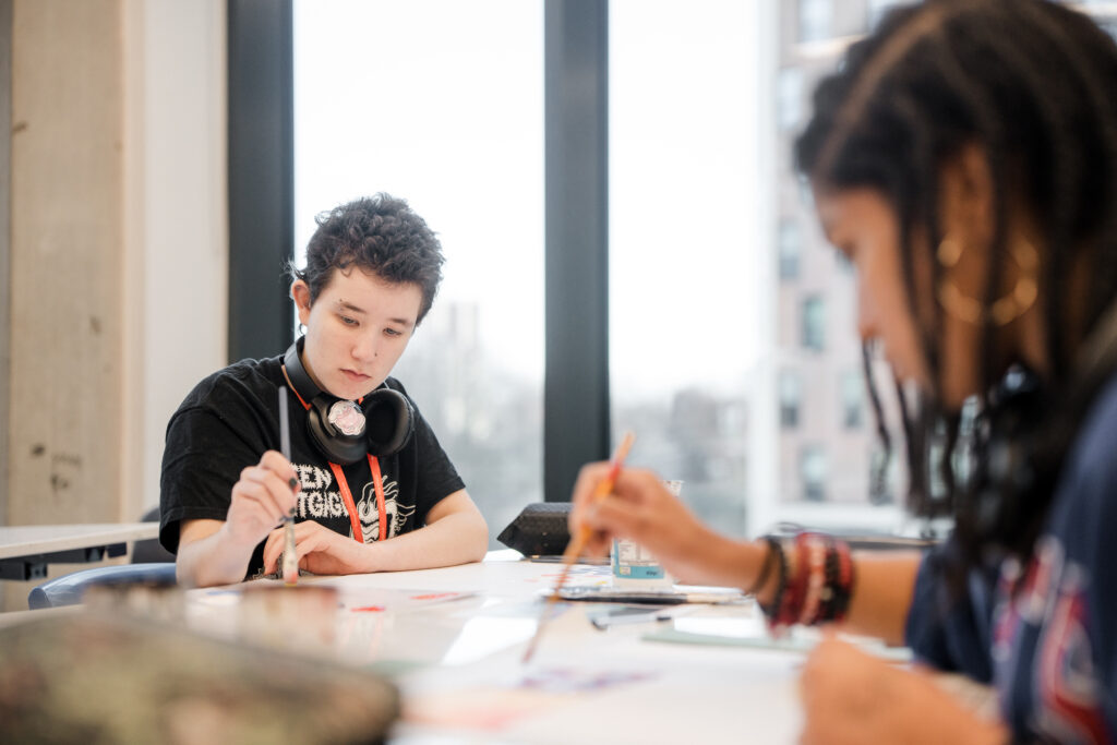 Two students painting