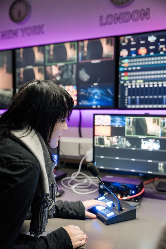 Student working in the production room for a live broadcast