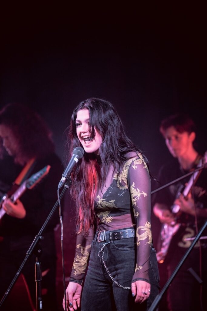 Full band playing on stage